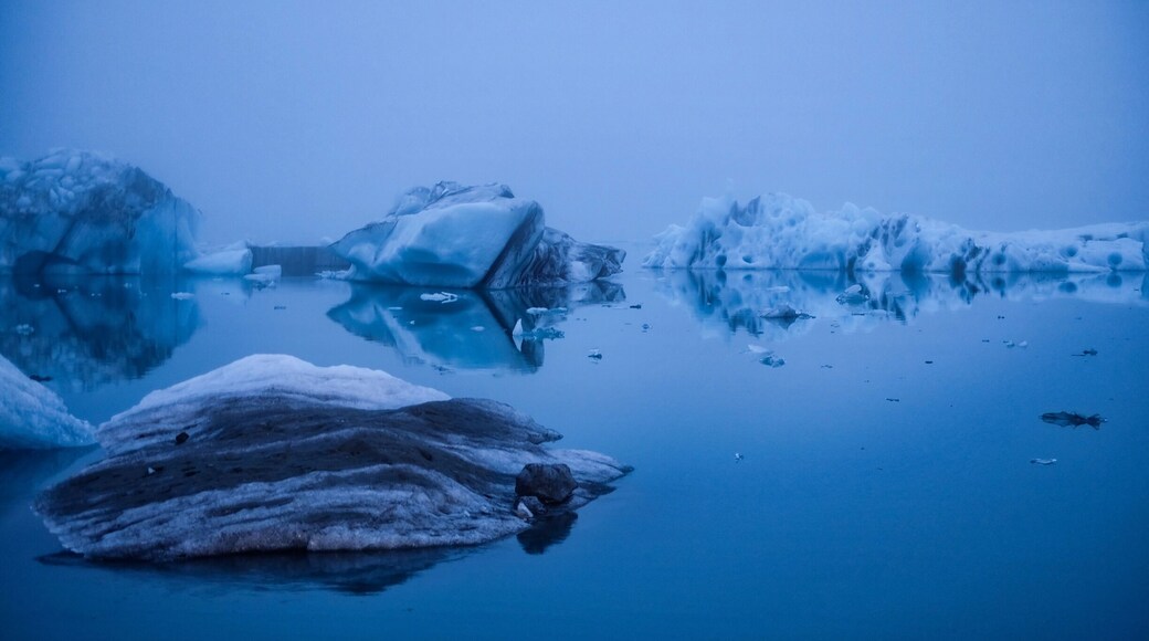 Arrived just minutes before midnight and it was still eerily bright; the summer midnight sun creating such a hauntingly surreal landscape by casting an atmospherically blue hue on the glacier and the surrounding lake.