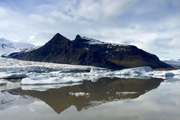 The smaller of the two lagoons. I saw this one first and it was amazing. It was off to feel like your driving in the middle of no where and then, boom, amazing glacier lagoon! Lol. I couldn't decide which boat tour to do so I chose to do both (at each lagoon). For the tour I actually liked this one better. Cozier, the guide seemed more knowledgeable, and the mountain backdrop was better. Definitely go hang out at the other lagoon on the beach, but I'd vote do the tour at this lagoon.
Love the reflections!!! This was approx 3pm in June.
O and I don't recommend if you want to try both tours to do them back to back. The lagoons are only 10km/10min from each other, but this tour went over for me so I missed the other one and had to reschedule it for the morning. Good thing I was staying nearby.
#waterlust