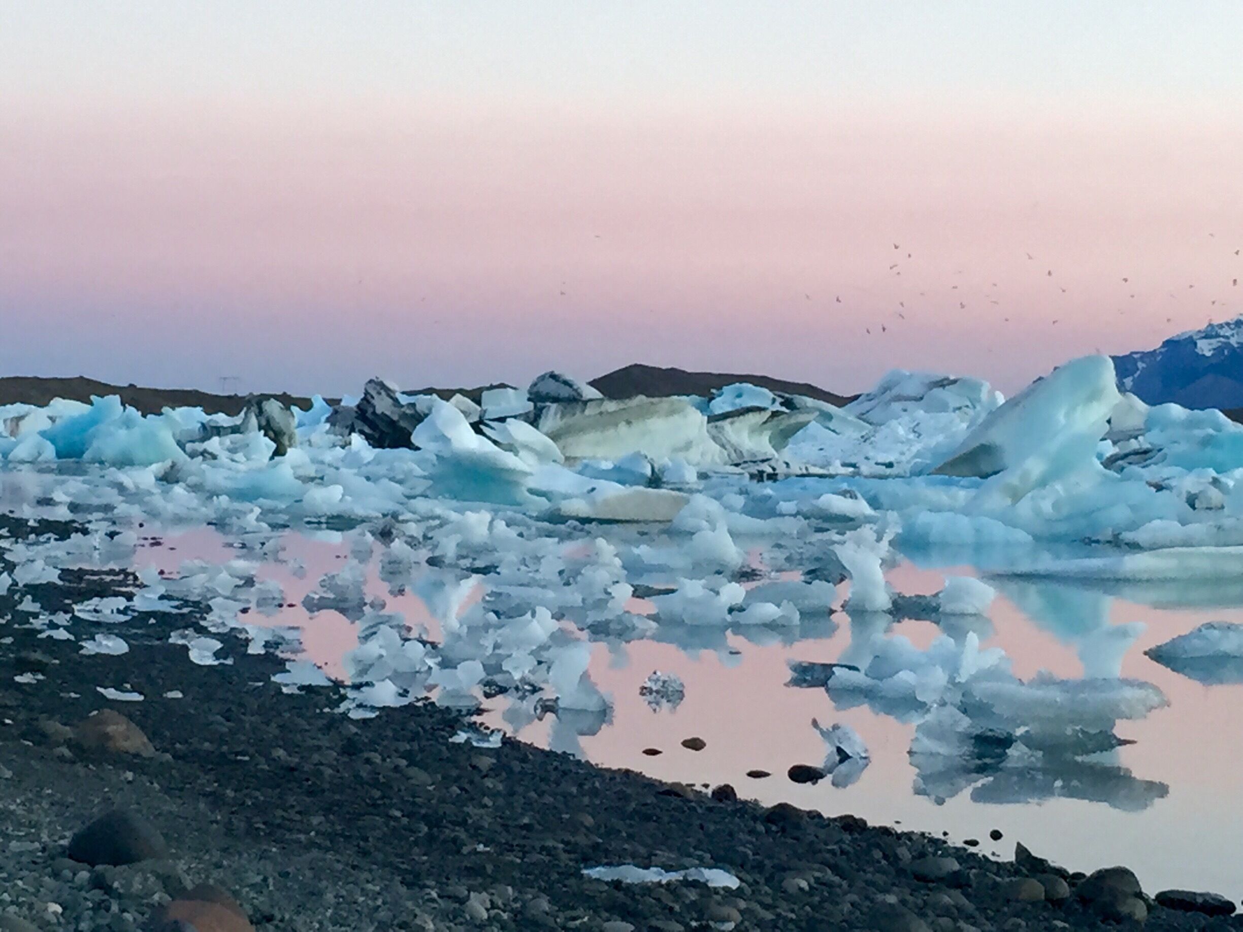 Jokusarlon under the midnight sun. One of my favorite moments of the entire trip. Literally around midnight. It doesn't get darker than this either. And There was maybe only 2-3 other people there, so I basically had the whole place to myself. I HIGHLY recommend staying around here and going between 11pm-2am. I could've stayed there all night but needed a few hours of sleep eventually.... Doesn't get more magical than this... I even saw 4-5 seals playing in the lagoon. 

#waterlust
#blue
#bestof5