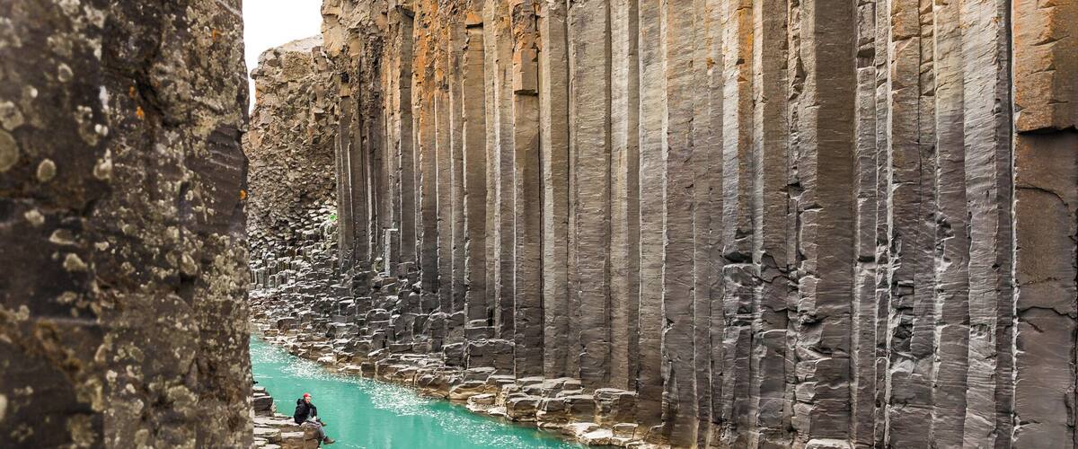 This is an amazing canyon we discovered in Iceland. It is not easy to get to, so it is not overly populated. We had to stop at a remote gas station and ask the locals. We then walked over three miles one way to find it. The canyon was hidden under water for a long time, until a hydroelectric plant was built and the water flow in the glacier river was extremely reduced. It has one of the biggest and most beautiful basalt columns formation in Iceland. The water is a beautiful turquoise blue. #Adventure