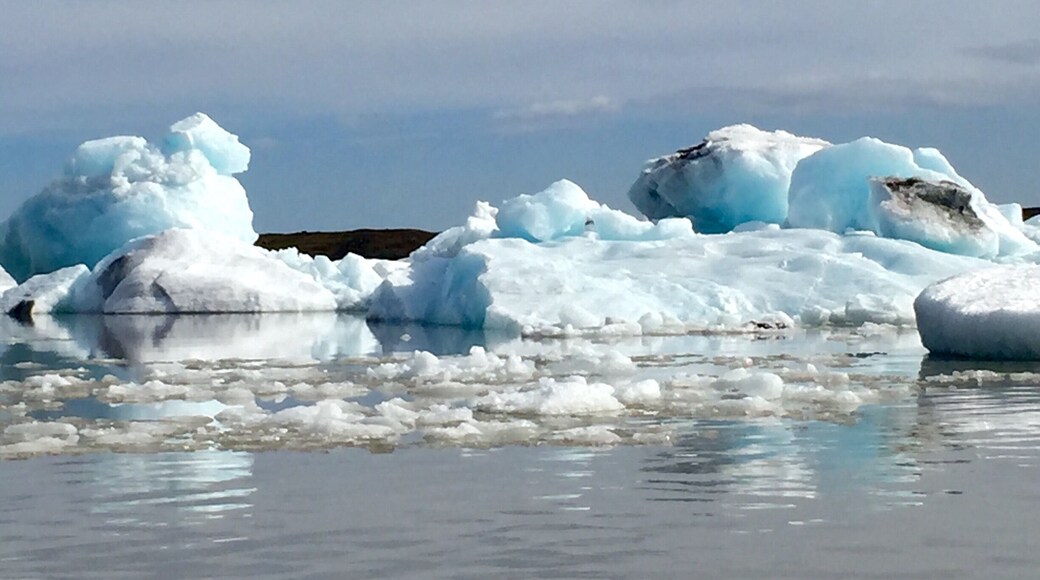 The smaller of the two lagoons. I saw this one first and it was amazing. It was off to feel like your driving in the middle of no where and then, boom, amazing glacier lagoon! Lol. I couldn't decide which boat tour to do so I chose to do both (at each lagoon). For the tour I actually liked this one better. Cozier, the guide seemed more knowledgeable, and the mountain backdrop was better. Definitely go hang out at the other lagoon on the beach, but I'd vote do the tour at this lagoon.
Love the reflections!!! This was approx 3pm in June.
O and I don't recommend if you want to try both tours to do them back to back. The lagoons are only 10km/10min from each other, but this tour went over for me so I missed the other one and had to reschedule it for the morning. Good thing I was staying nearby.
#blue
