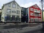 A street with buildings, including a hotel and a restaurant.