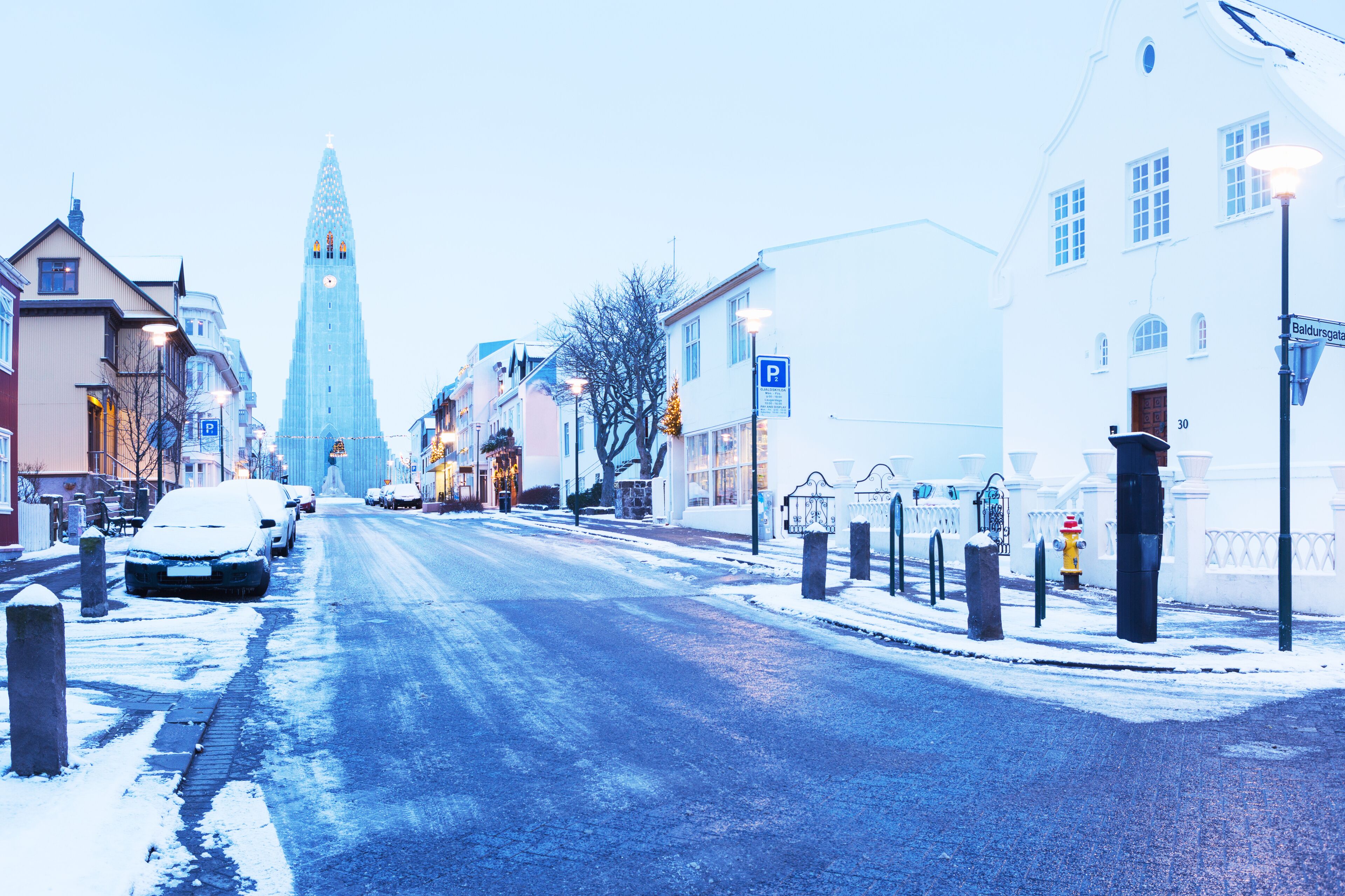 Old street of downtown Reykjavik at twilight, Iceland . in the background church of Hallgrimur. Toned image