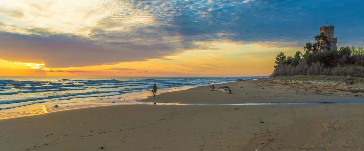 Pineto (Abruzzo, Italy) - The sunrise on the Adriatic sea, from the Pineto beach, beside the Torre di Cerrano castle