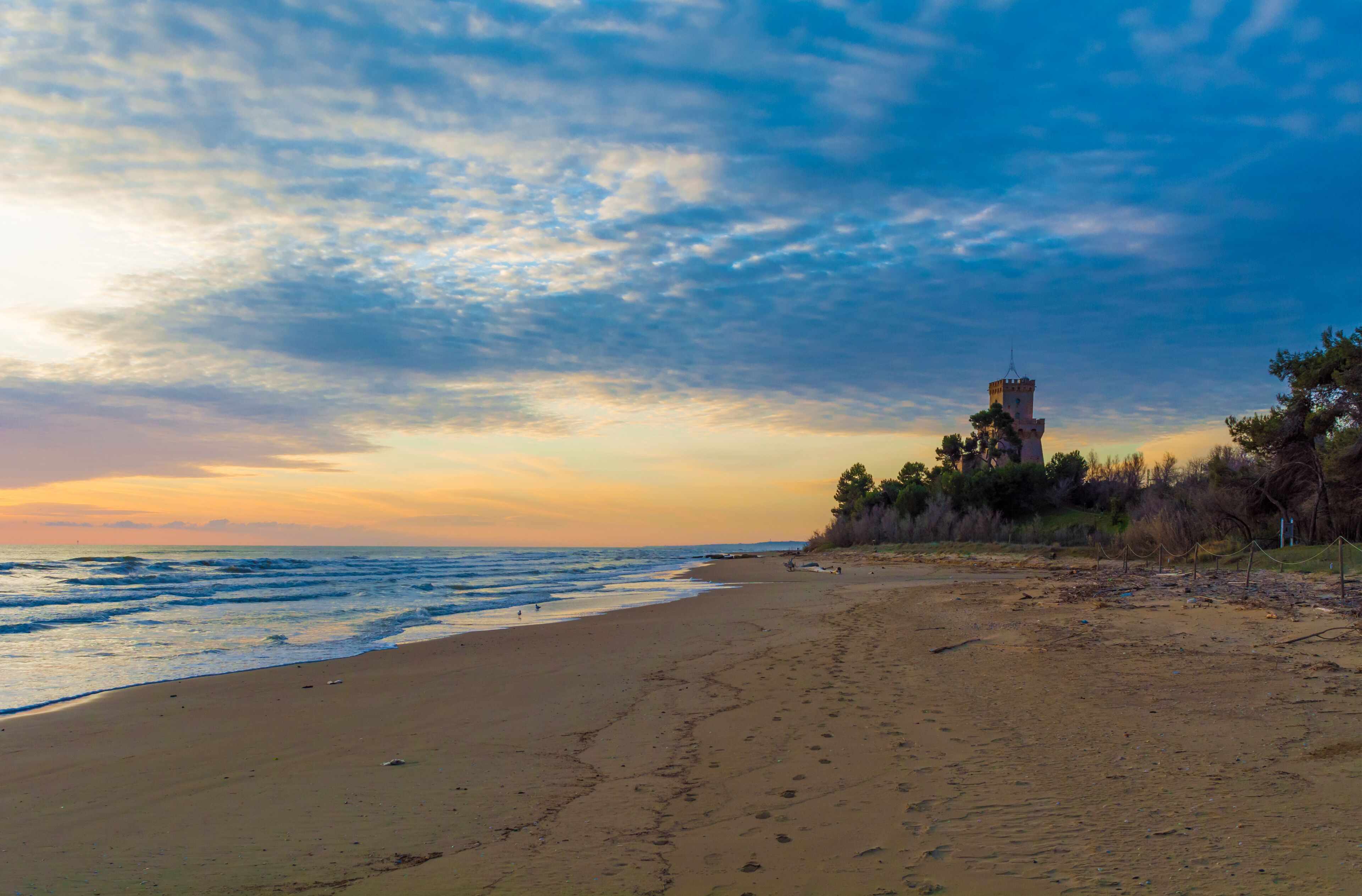 Pineto (Abruzzo, Italy) - The sunrise on the Adriatic sea, from the Pineto beach, beside the Torre di Cerrano castle