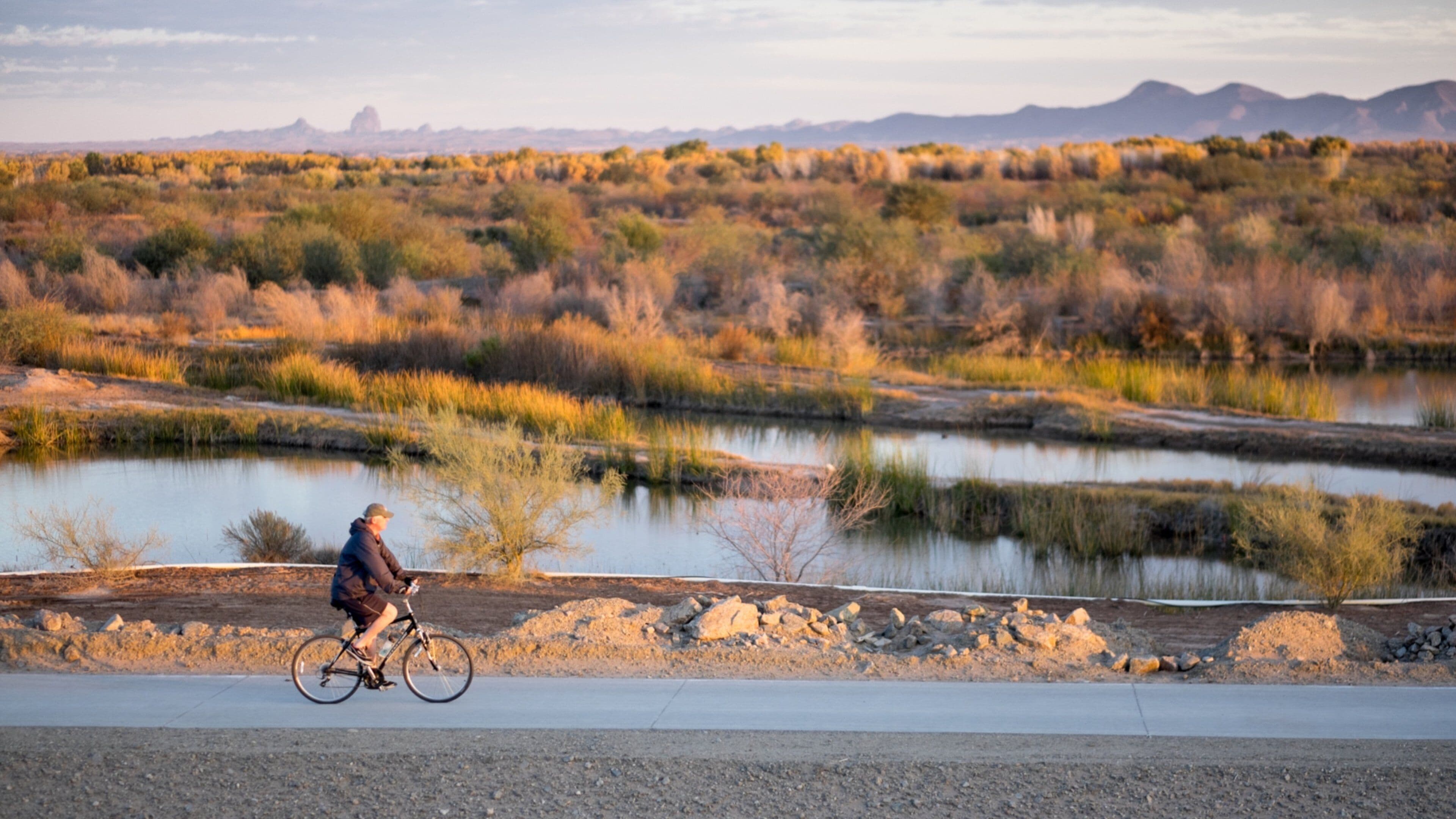 Western Arizona which includes tranquil scenes, a sunset and a river or creek