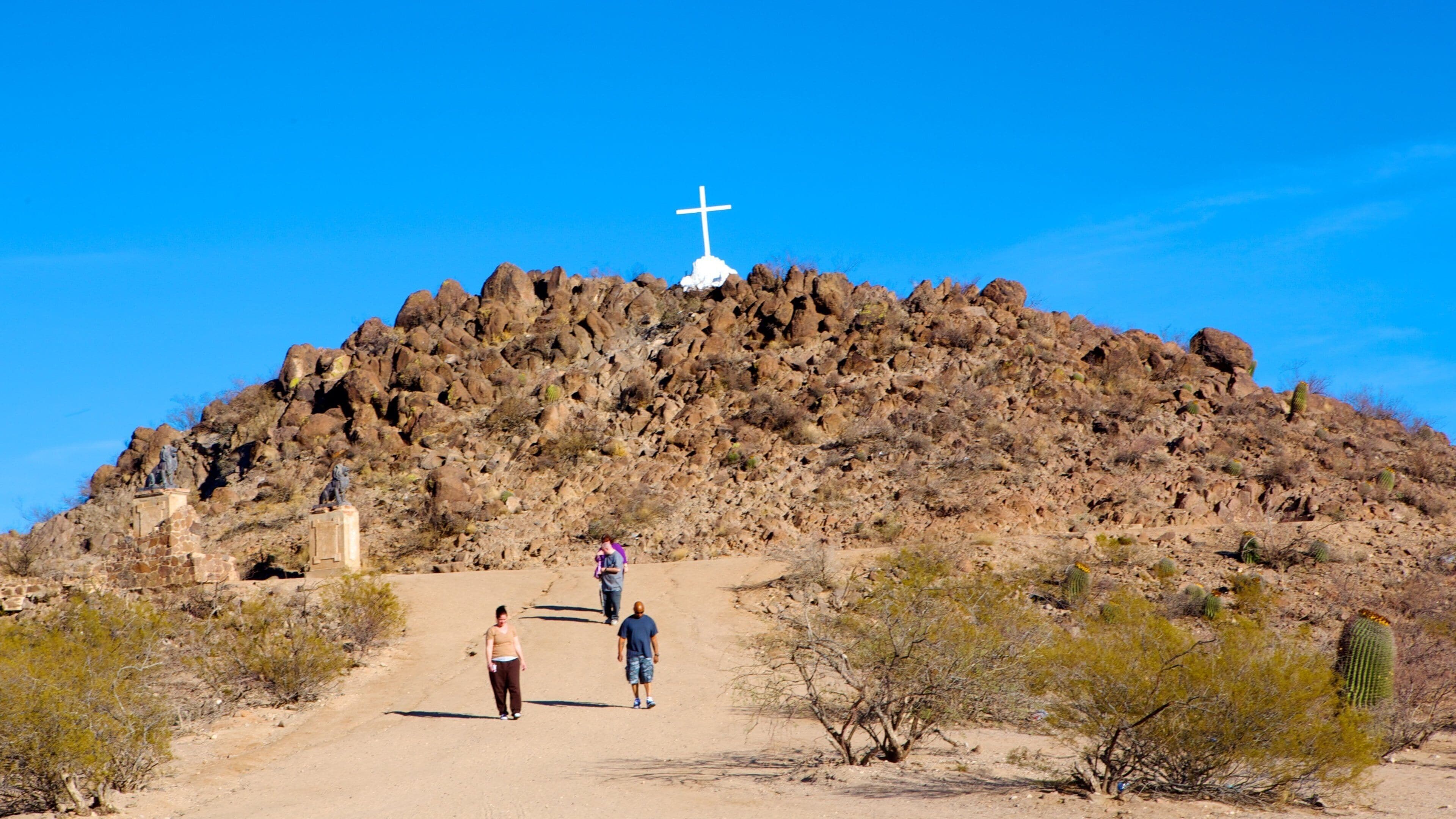 Southern Arizona featuring desert views and religious aspects as well as a small group of people