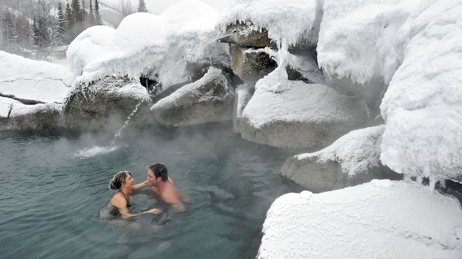 Far North Alaska showing snow and a hot spring as well as a couple