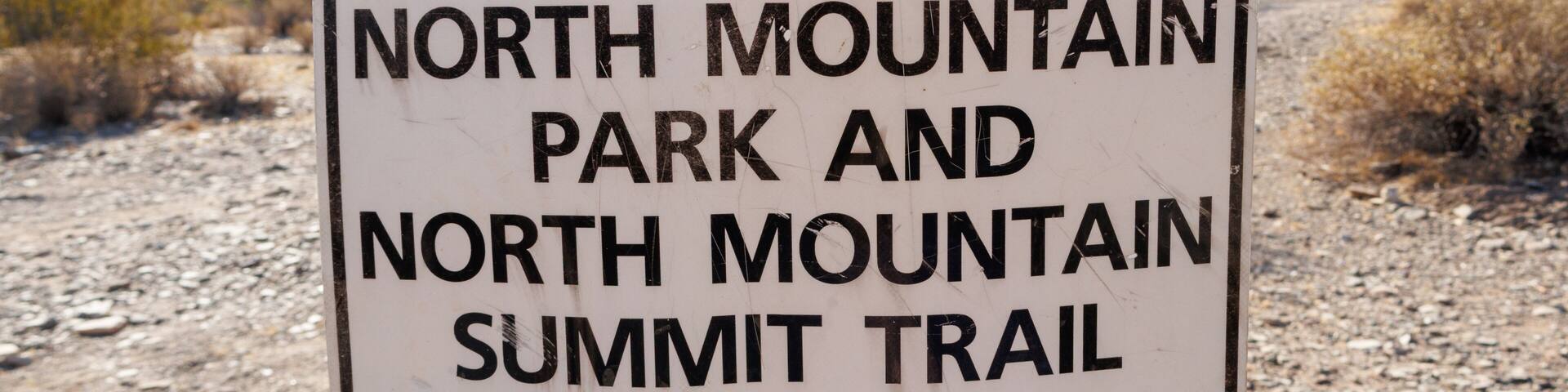 A directional sign for North Mountain Park and North Mountain Summit Trail.