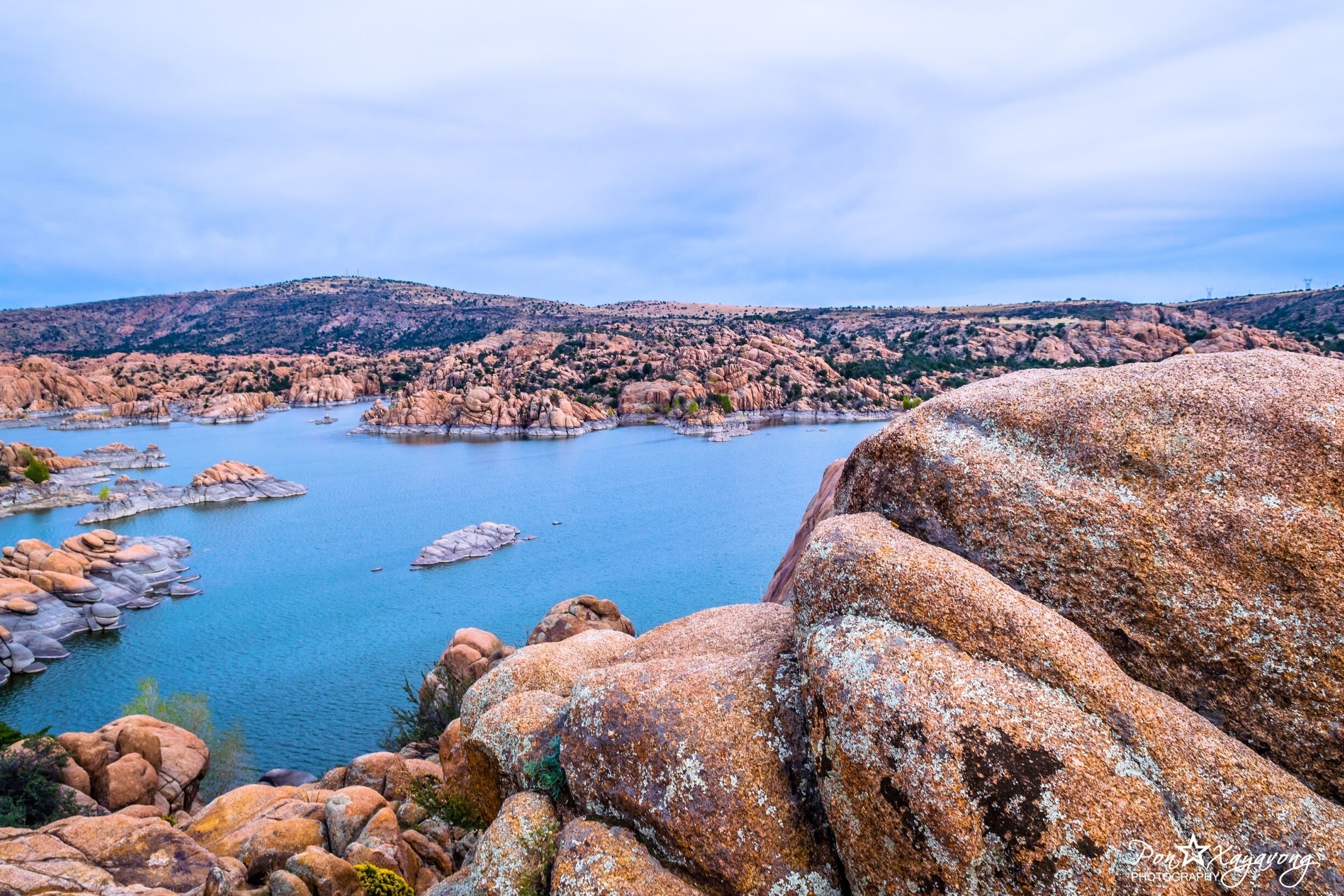 $2 entrance fee. Watson Lake at Watson Park is conveniently located about 4 miles from Prescott Arizona and features fishing, boating, kayaking, canoeing, hiking, rock climbing, camping and day picnicking. Watson's water surface is about 380 surface acres and distinguished by its sky blue calm waters surrounded by huge granite boulders. 