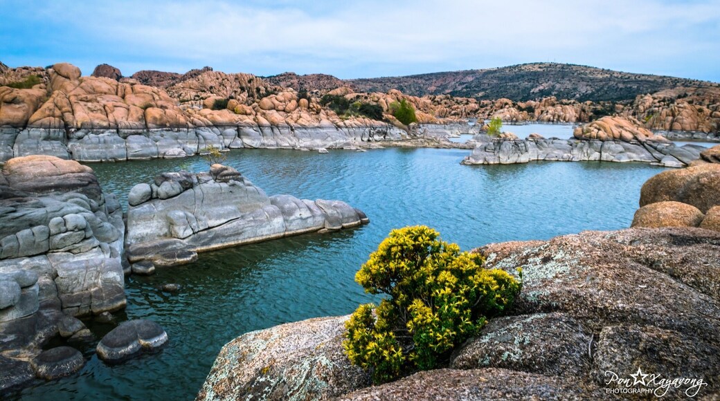 $2 entrance fee. Watson Lake at Watson Park is conveniently located about 4 miles from Prescott Arizona and features fishing, boating, kayaking, canoeing, hiking, rock climbing, camping and day picnicking. Watson's water surface is about 380 surface acres and distinguished by its sky blue calm waters surrounded by huge granite boulders.