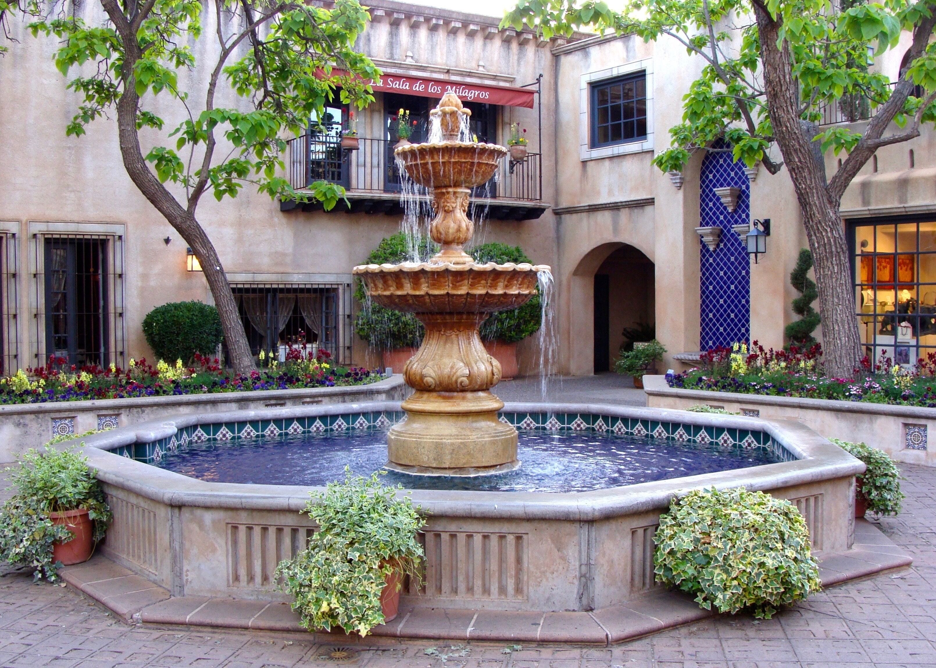 Tlaquepaque (pronounced T-la-keh-pah-keh), Sedona Arizona's Arts & Crafts Village, on of the best things to do in Sedona. Nestled beneath the shade of the sycamores on the banks of beautiful Oak Creek in Sedona, Tlaquepaque is the most distinctive Sedona shopping experience to be found in the Southwest. Authentically fashioned after a traditional Mexican village, Tlaquepaque, meaning the "best of everything," has been a Sedona landmark since the 1970's. Its vine covered stucco walls, cobble-stoned walkways and magnificent arched entryways give you the feeling that Tlaquepaque has been here for centuries. 

Originally conceived as an artist community, Tlaquepaque is a perfect setting to witness gifted Sedona artisans absorbed in their work. It's not uncommon to venture upon a well-known sculptor working on his or her latest piece right in one of the Tlaquepaque galleries. With over 50 specialty shops and exclusive art galleries, shopping becomes a joyful revelation of fabulous art treasures and distinctive gifts around every corner.

#LikeALocal