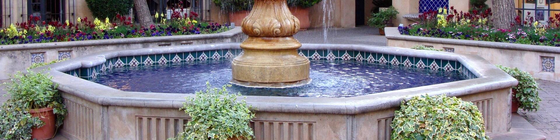 Tlaquepaque (pronounced T-la-keh-pah-keh), Sedona Arizona's Arts & Crafts Village, on of the best things to do in Sedona. Nestled beneath the shade of the sycamores on the banks of beautiful Oak Creek in Sedona, Tlaquepaque is the most distinctive Sedona shopping experience to be found in the Southwest. Authentically fashioned after a traditional Mexican village, Tlaquepaque, meaning the "best of everything," has been a Sedona landmark since the 1970's. Its vine covered stucco walls, cobble-stoned walkways and magnificent arched entryways give you the feeling that Tlaquepaque has been here for centuries.
Originally conceived as an artist community, Tlaquepaque is a perfect setting to witness gifted Sedona artisans absorbed in their work. It's not uncommon to venture upon a well-known sculptor working on his or her latest piece right in one of the Tlaquepaque galleries. With over 50 specialty shops and exclusive art galleries, shopping becomes a joyful revelation of fabulous art treasures and distinctive gifts around every corner.
#LikeALocal