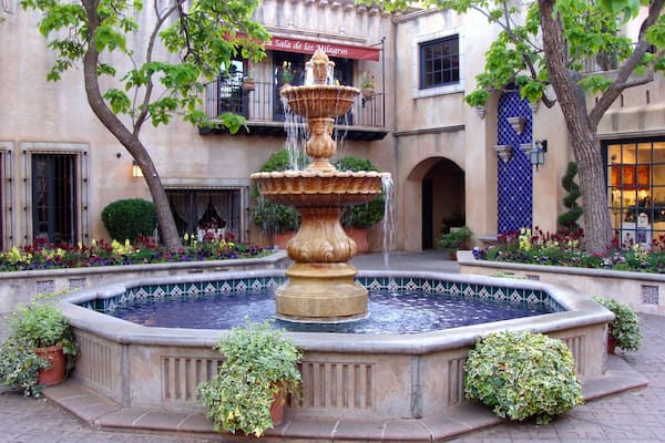 Tlaquepaque (pronounced T-la-keh-pah-keh), Sedona Arizona's Arts & Crafts Village, on of the best things to do in Sedona. Nestled beneath the shade of the sycamores on the banks of beautiful Oak Creek in Sedona, Tlaquepaque is the most distinctive Sedona shopping experience to be found in the Southwest. Authentically fashioned after a traditional Mexican village, Tlaquepaque, meaning the "best of everything," has been a Sedona landmark since the 1970's. Its vine covered stucco walls, cobble-stoned walkways and magnificent arched entryways give you the feeling that Tlaquepaque has been here for centuries.
Originally conceived as an artist community, Tlaquepaque is a perfect setting to witness gifted Sedona artisans absorbed in their work. It's not uncommon to venture upon a well-known sculptor working on his or her latest piece right in one of the Tlaquepaque galleries. With over 50 specialty shops and exclusive art galleries, shopping becomes a joyful revelation of fabulous art treasures and distinctive gifts around every corner.
#LikeALocal