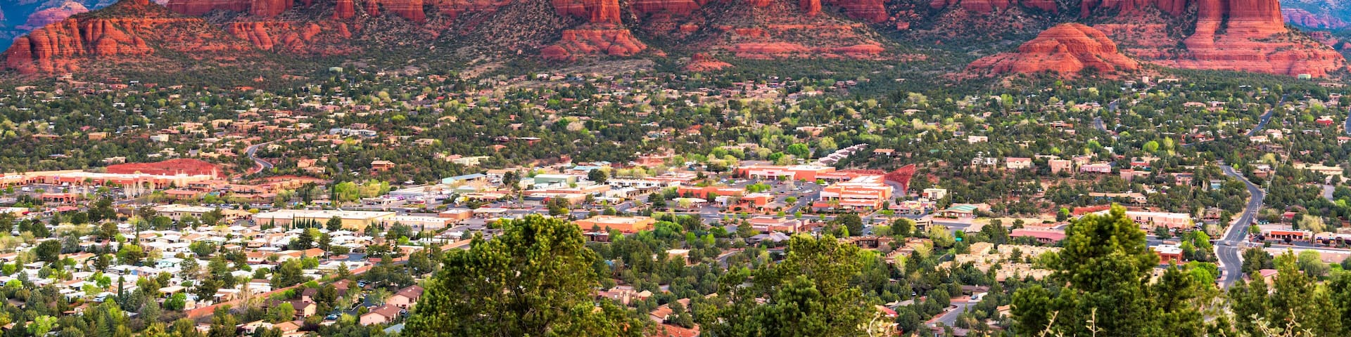 Sedona, Arizona, USA downtown cityscape and mountains.