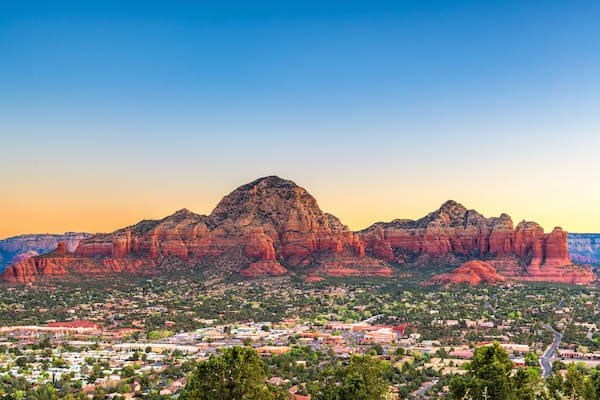 Sedona, Arizona, USA downtown cityscape and mountains.