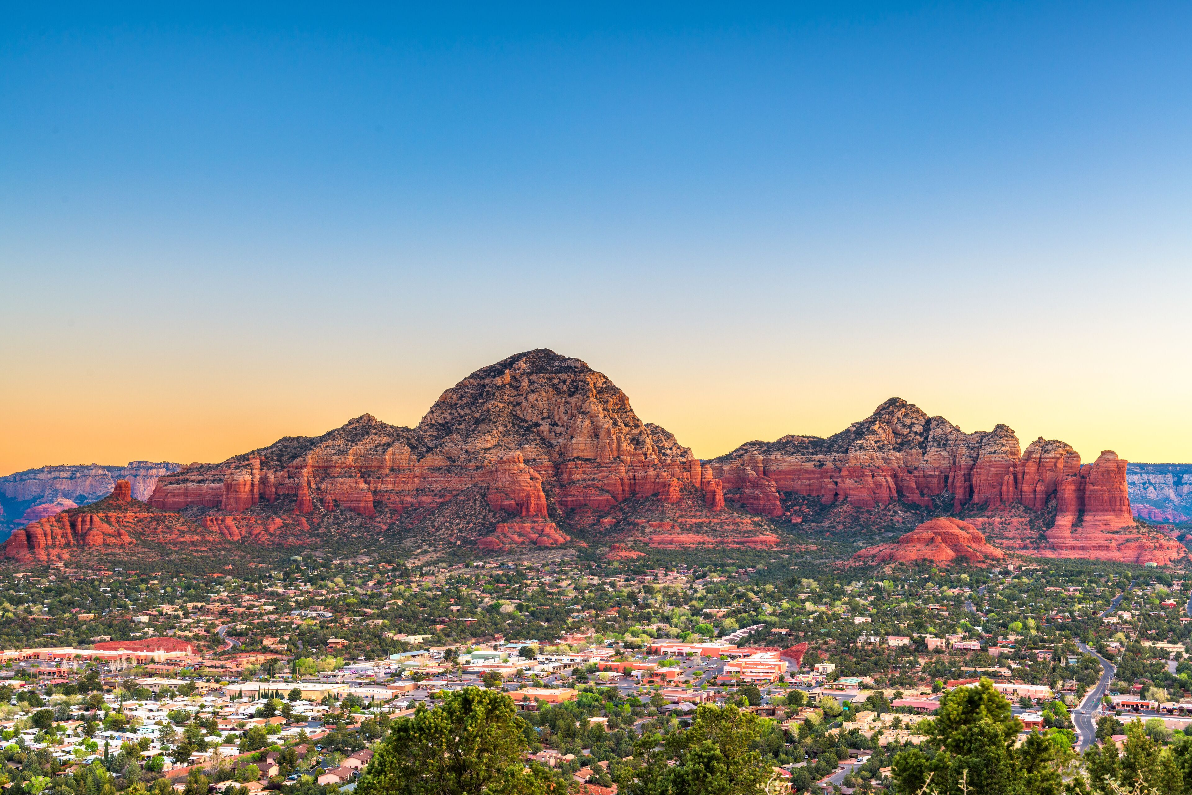 Sedona, Arizona, USA downtown cityscape and mountains.