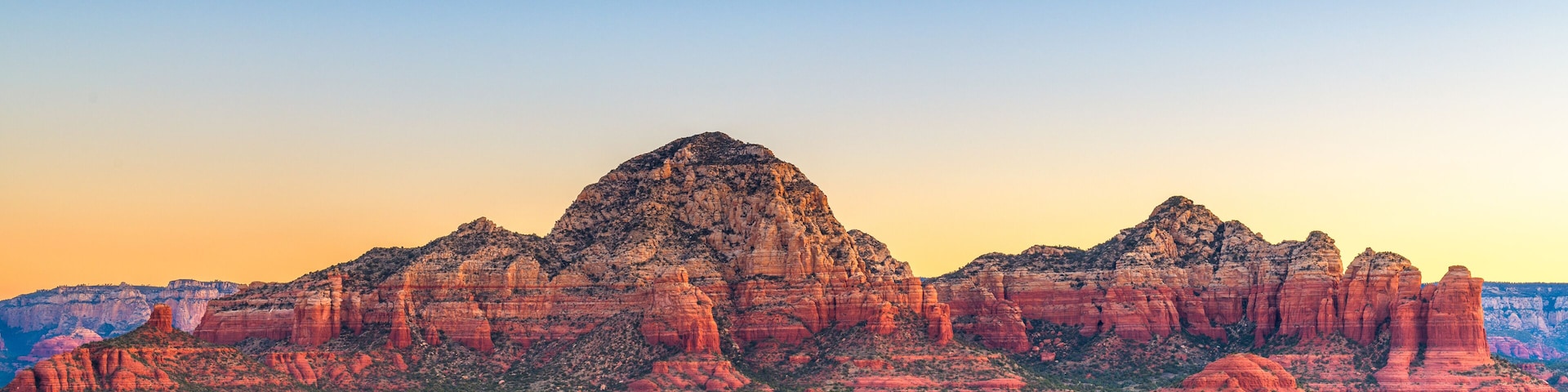 Sedona, Arizona, USA downtown cityscape and mountains.