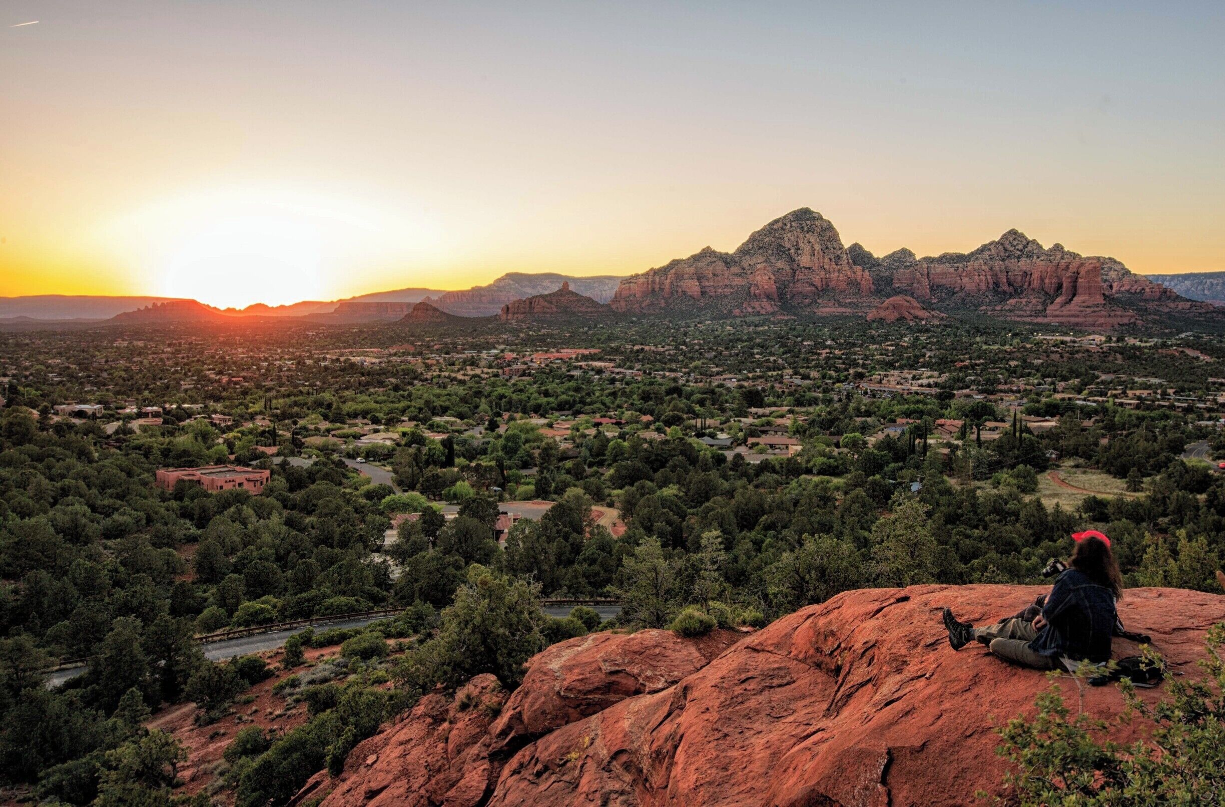 Sunset at Airport Mesa is a must if in Sedona. I recommend hiking to the knoll below the mesa for a view with fewer people. The mesa is accessible by car and attracts large numbers of people. You have to hike to the knoll and far fewer people congregate here.  