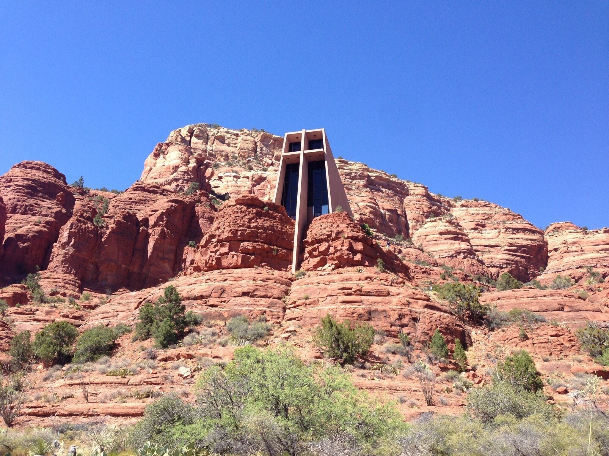 A rock formation with a cross structure in the center.