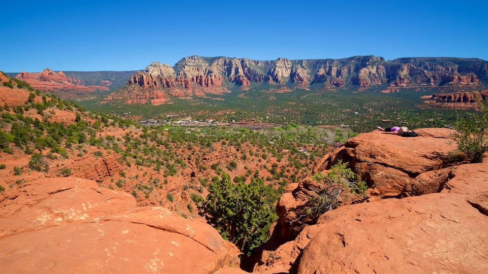 A red rock landscape with a town in the valley.