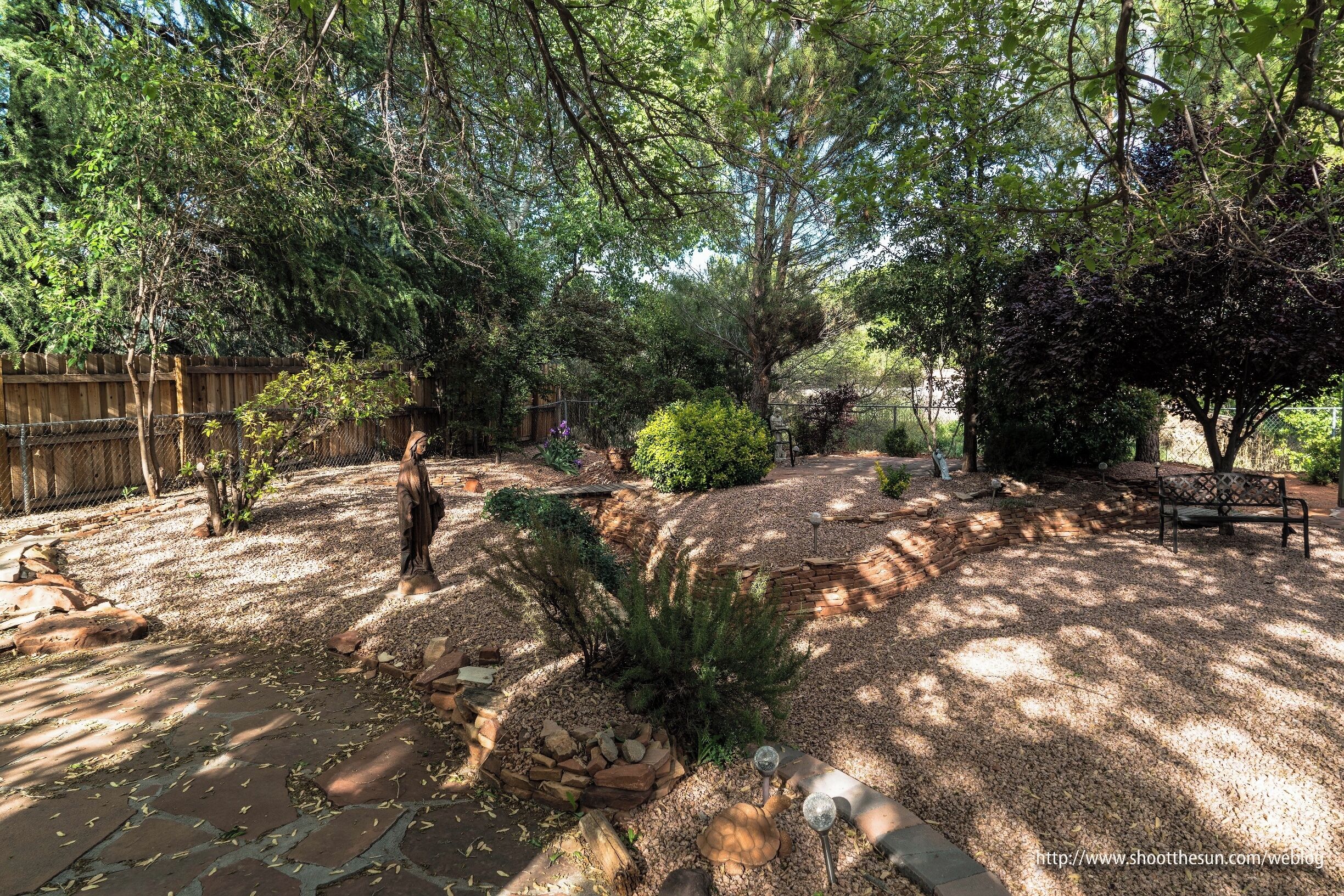 I can't say enough about the place where we stayed south of Sedona.  Unassuming enough, though with all the creature comforts.  But the backyard was astounding.  The light and color that would play over this place at dawn and dusk were a delight to behold.  The yard had three religious statues, but they didn't dominate the landscape in any way.  Instead, they seem to lend a meditative calm to the place, fixing your eye from time to time as it wandered through the shadows.