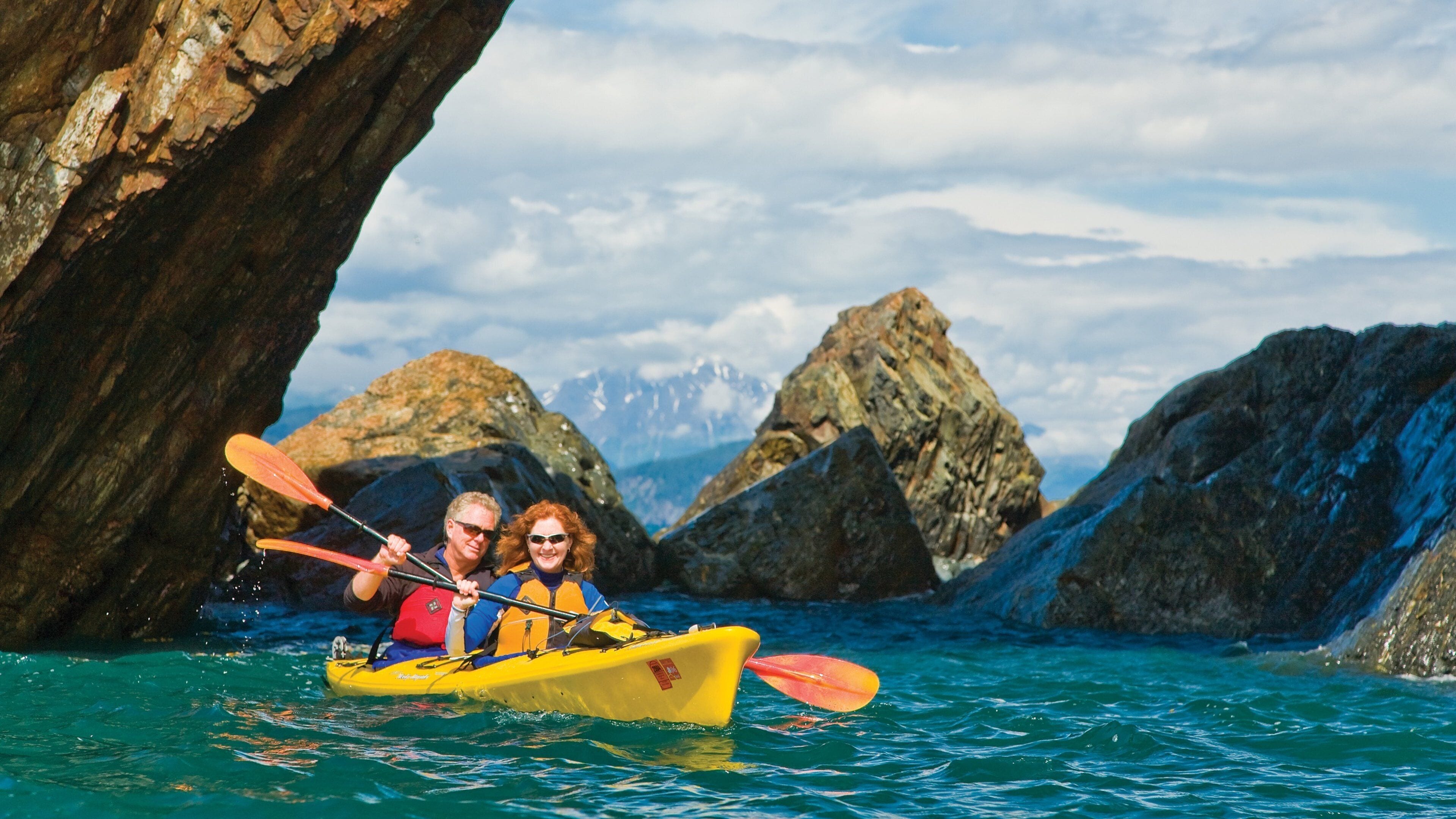 Kenai Peninsula which includes a lake or waterhole, kayaking or canoeing and rocky coastline