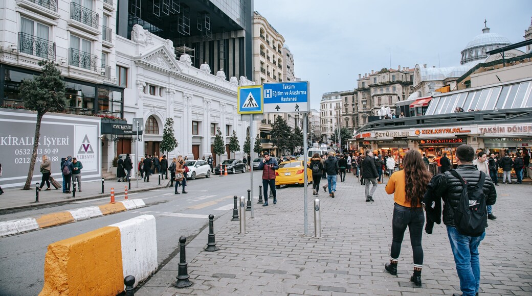 Taksim which includes street scenes and a city as well as a couple