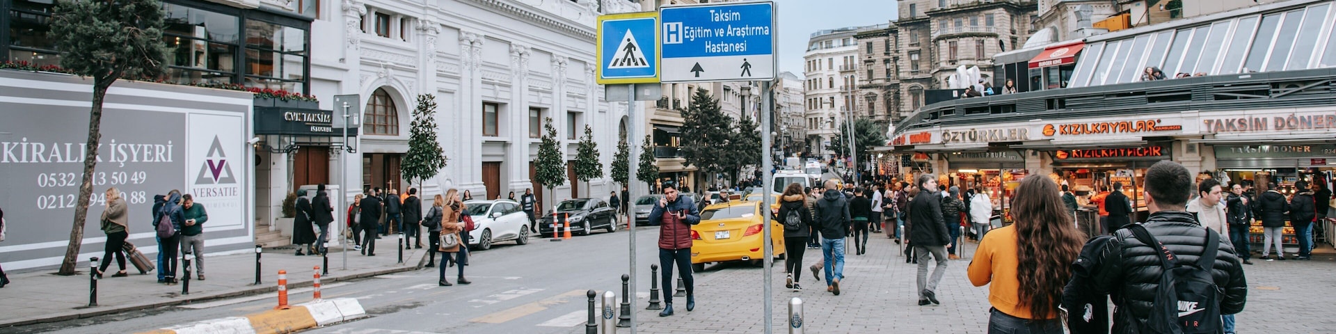 Taksim which includes street scenes and a city as well as a couple