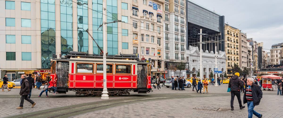 Taksim which includes street scenes, railway items and a city