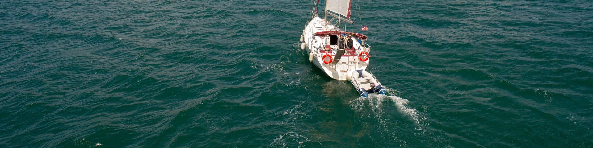 Aerial view of sailboat at sea in Turkey. Aerial view of beautiful green lagoon at hot summer day