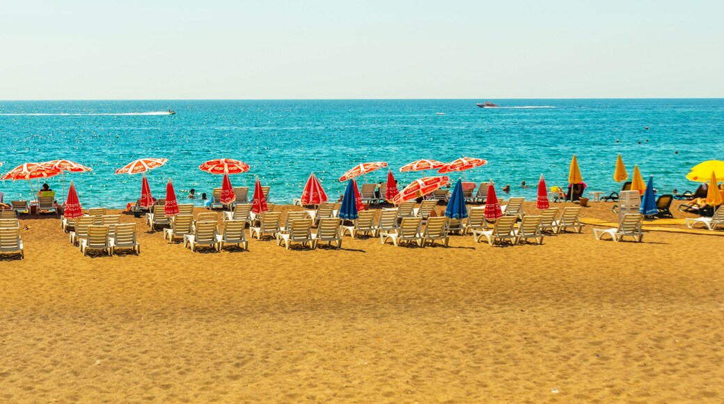 ANTALYA, TURKEY: Sun loungers and umbrellas on the Lara beach on a sunny summer day in Antalya.