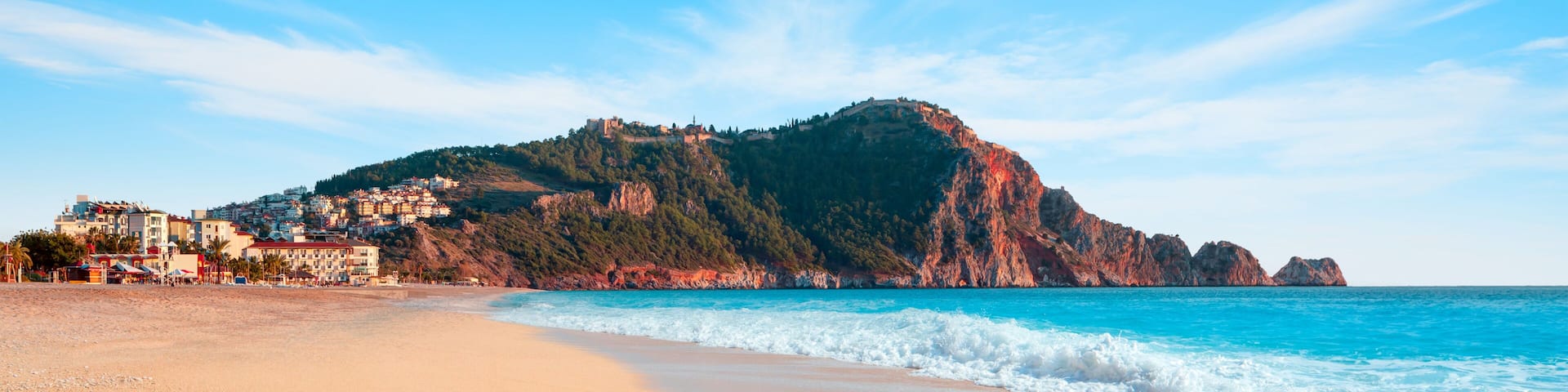 Beach of Cleopatra with sea and rocks of Alanya peninsula - Antalya, Turkey