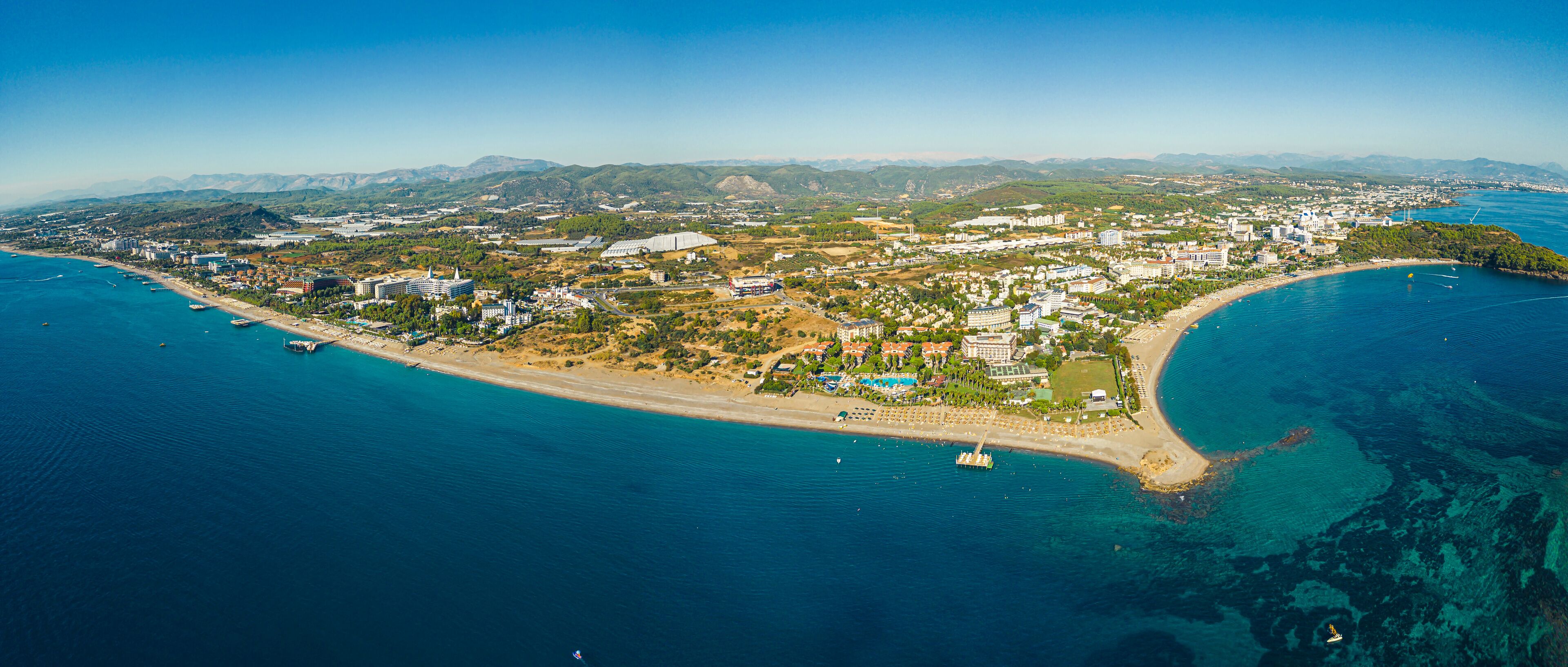 Beautiful panoramic landscape and seashore of Okurcalar, Turkey. Perfect summer holidays destination for people who enjoy beautiful weather, sandy beach, and clear turquoise sea. High quality photo