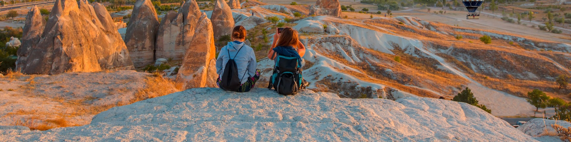 Hot air balloon flying over rock landscape at Cappadocia Turkey, Shutterstock ID 730555306, Purchase Order: -