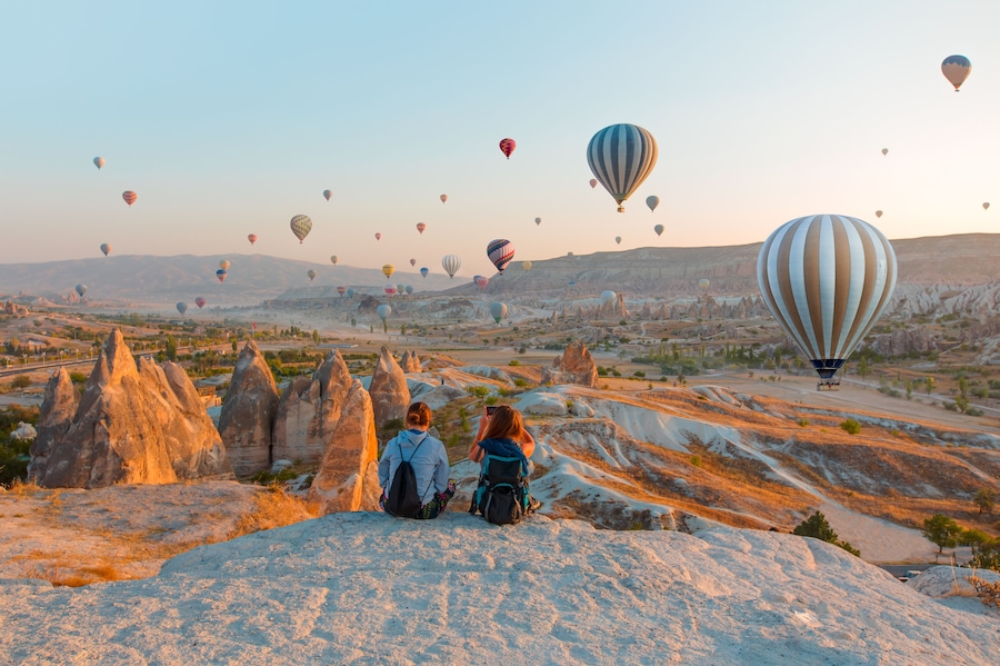 Hot air balloon flying over rock landscape at Cappadocia Turkey, Shutterstock ID 730555306, Purchase Order: -
