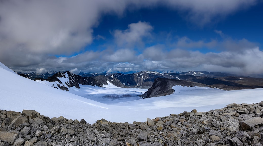 Panorama of mountain landscape as seen from Glittertind mountain eastern slope in Northern direction of Trololsteintjonne glacial lake. Lom, Norway