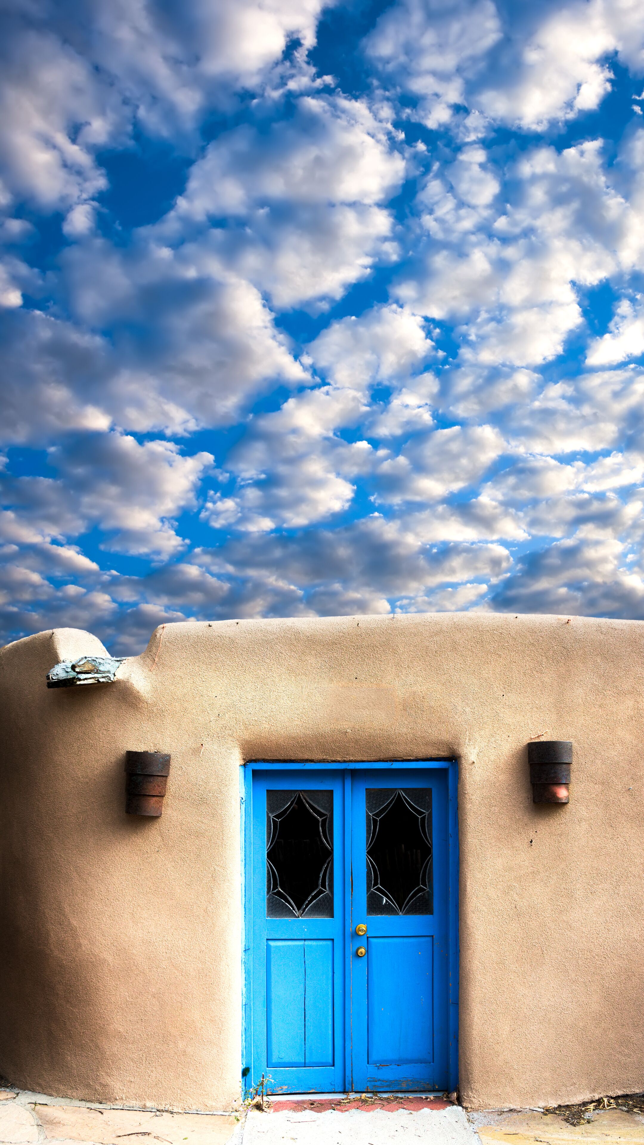 Adobe Building with a Blue Front Door