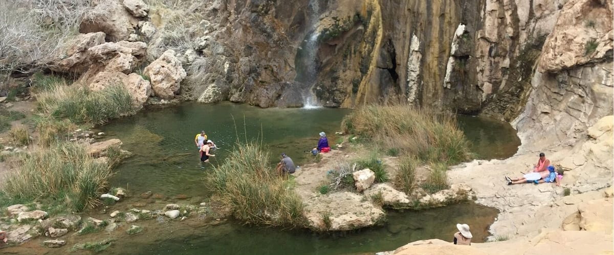 Sitting Bull Falls view from the observation deck at the base. Getting down to the rocks below to take a dip requires managing some rough steps and slippery surfaces.