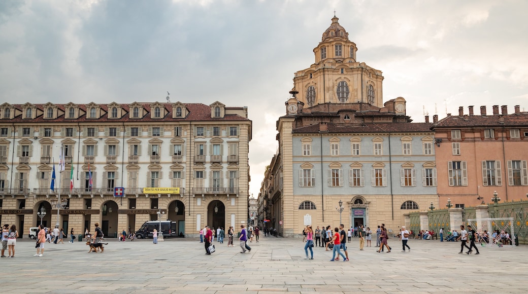 Piazza Castello which includes a square or plaza, street scenes and heritage architecture