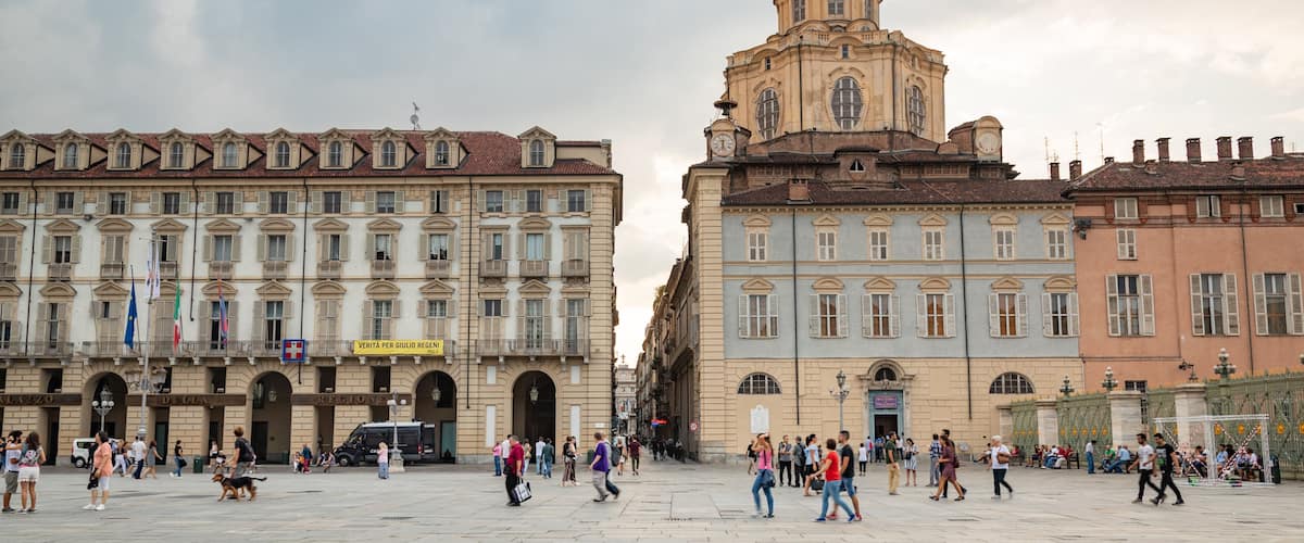 Piazza Castello which includes a square or plaza, street scenes and heritage architecture