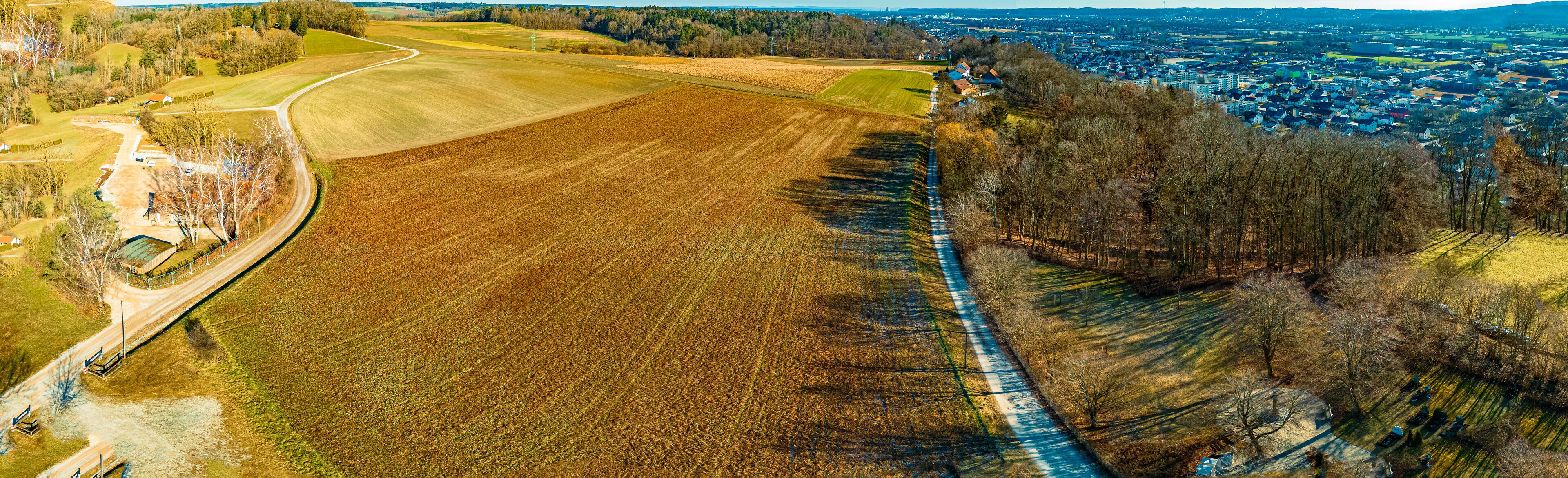 High resolution stitched winter drone panorama captured in flight near a church at Eugenbach, Altdorf, Landshut, Bavaria, Germany