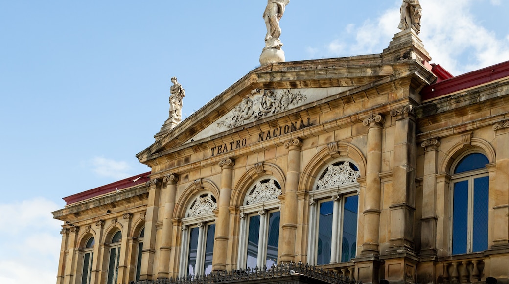 Low angle view of the 1897 National Theatre’s top story, with its magnificent neo-classical architecture and statues, San Jose, Costa Rica