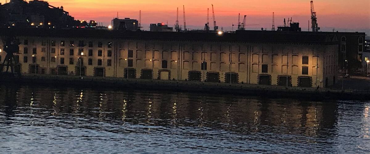 Sailing into dock beautiful sunrise  Genoa Italy