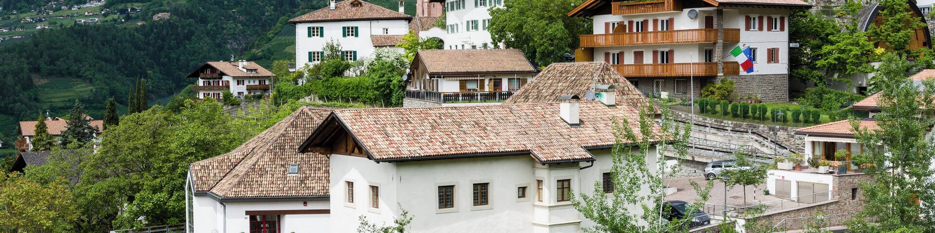 A village with traditional architecture nestled in a mountainous landscape.