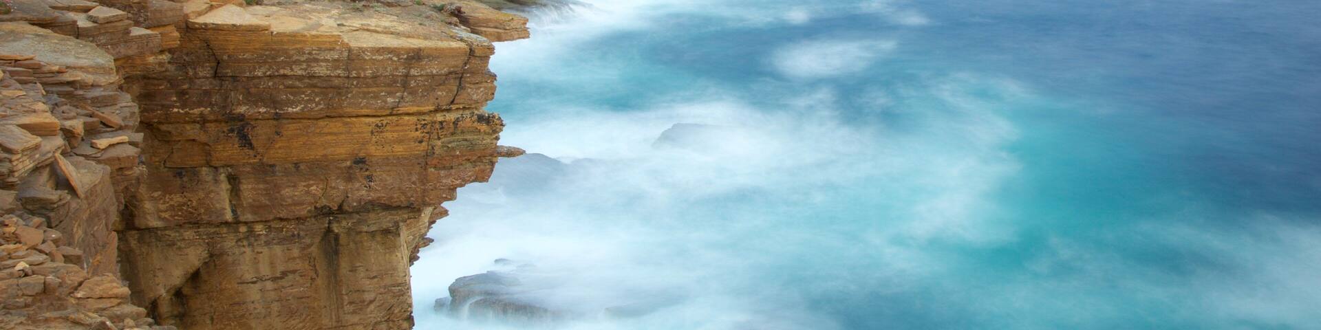 Stromness which includes rocky coastline