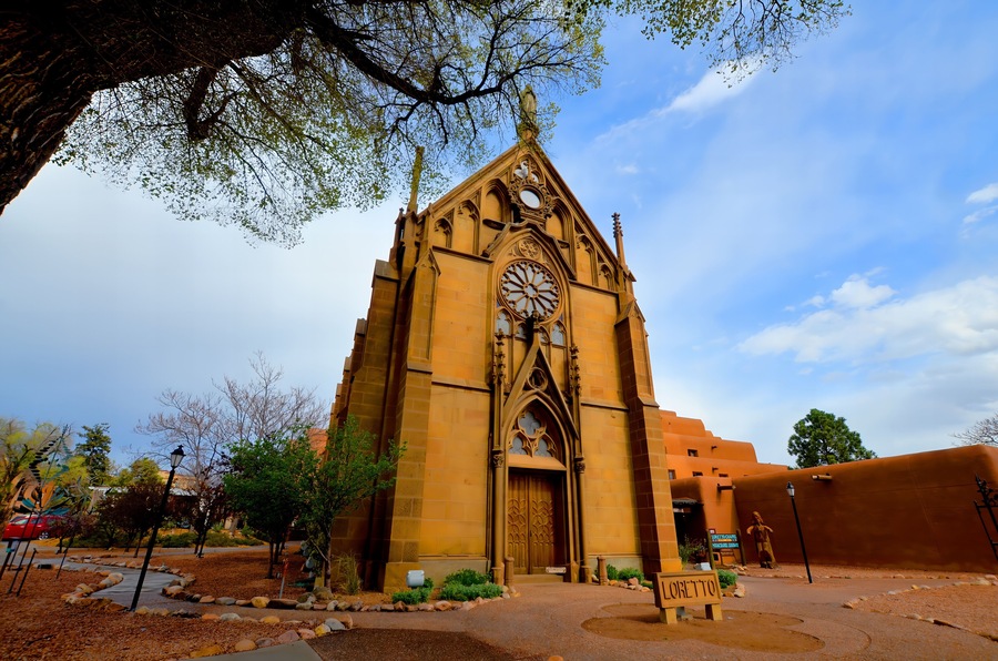 A church with a large rose window and a pointed arch.