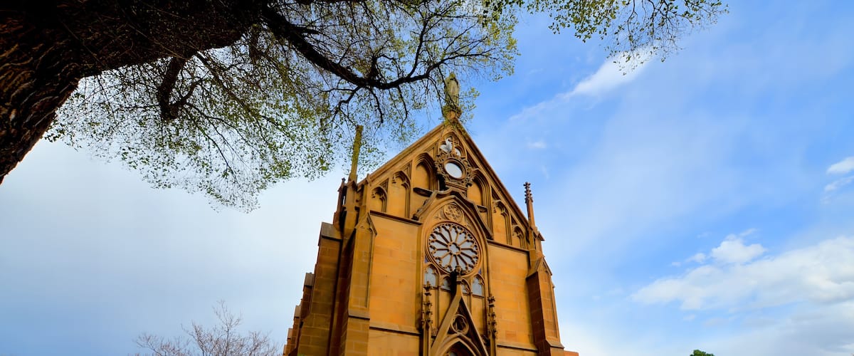 A church with a large rose window and a pointed arch.