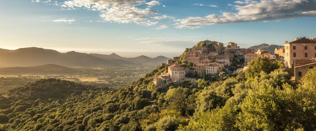 Village of Belgodere in Corsica lit by late afternoon sun