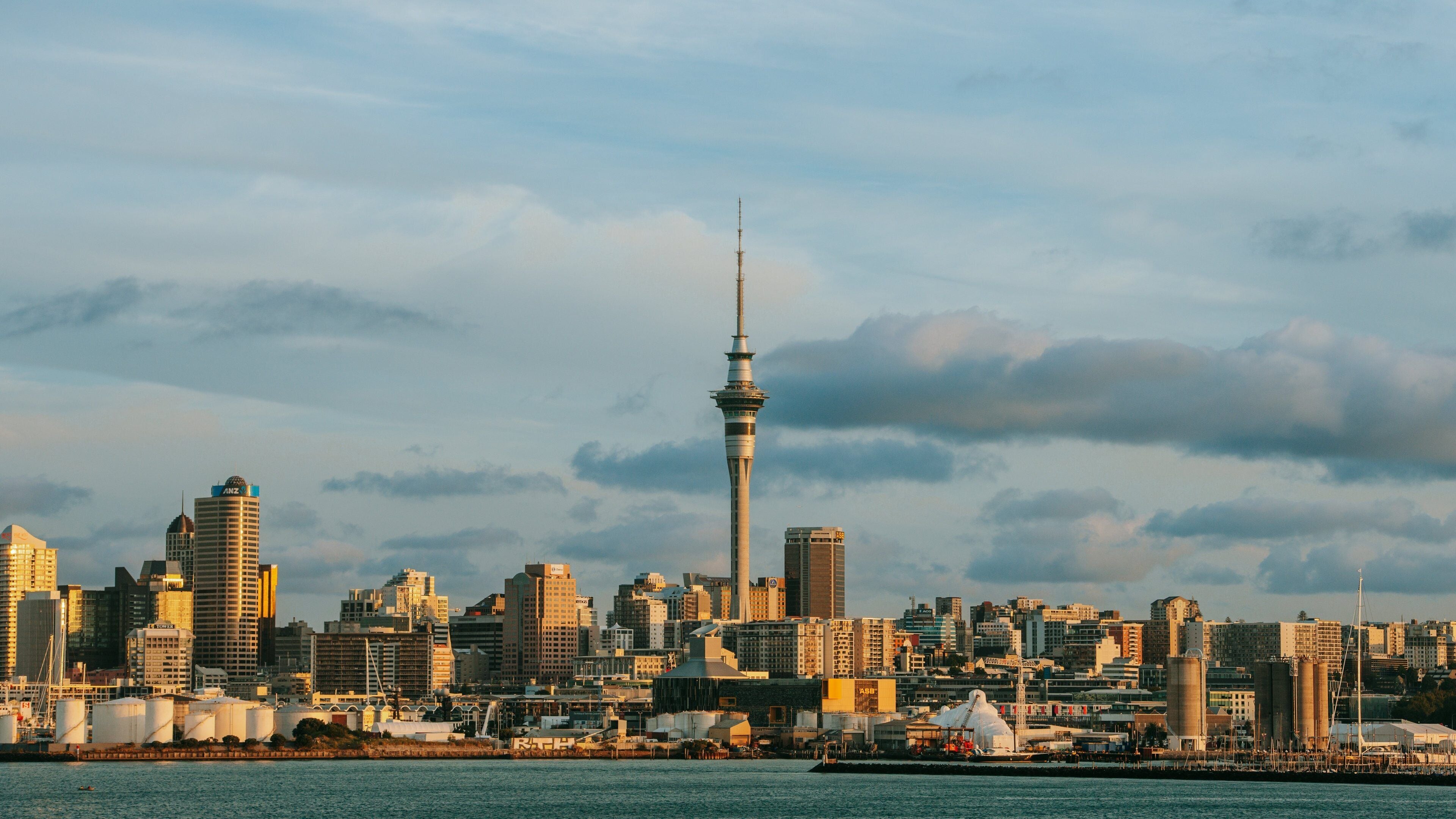 Sky Tower which includes a city, modern architecture and a sunset